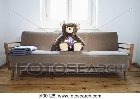 Teddy On Sofa With Gift Parcel Stock Photography Jrf00125 Teddy On Sofa With Gift Parcel Stock