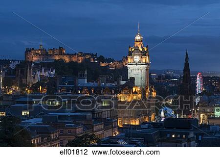 United Kingdom Scotland Edinburgh Old Town With Tower Of Balmoral Hotel And Edinburgh Castle In The Evening Stock Image - 