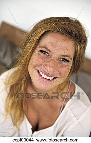 Portrait Of Laughing Strawberry Blonde Young Woman With Freckles