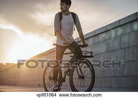 riding bike with backpack