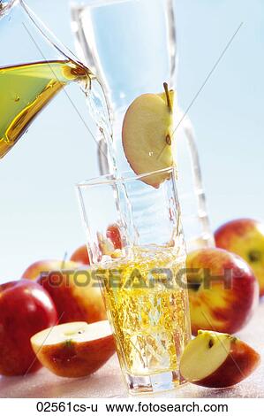 Download Pouring Apple Juice Into Glass Stock Photograph 02561cs U Fotosearch PSD Mockup Templates
