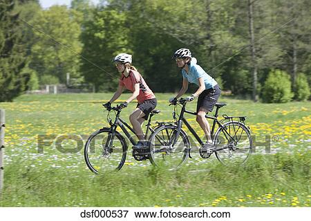 women riding bicycles