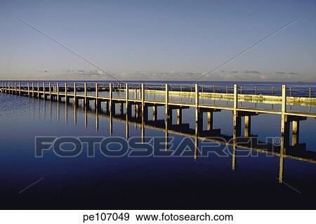 Stock Photo - background, beauty, blue, coast, contrast, day, gold. Fotosearch