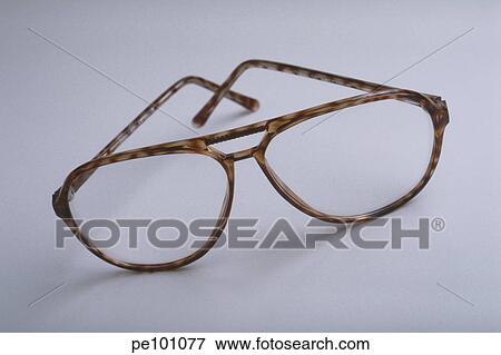 Stock Photo - brown, fashion, frame, glass, glasses, household, indoor. Fotosearch