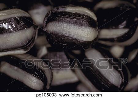 Stock Image - background, black, candy, confectionery, dark, equality, food. Fotosearch