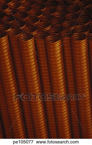 Stock Photo - background, dark, day, indoor, industry, metal, orange. Fotosearch