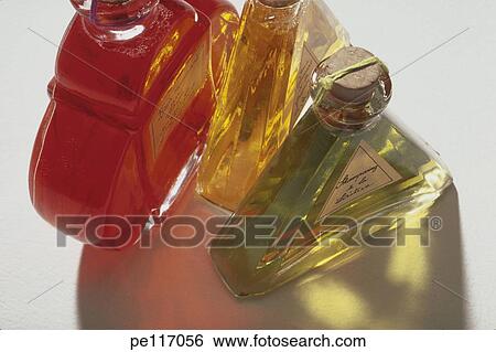 Stock Photograph - assorted, reflection, red, perfume, arrangement. Fotosearch