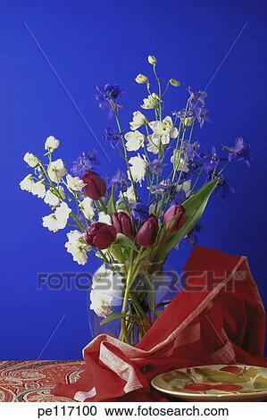 Stock Image - blue, still life, red, flower, arrangement. Fotosearch