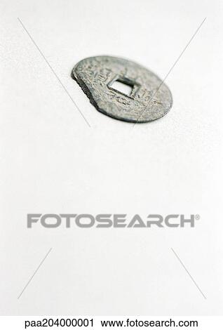 Antique coin with hole in middle. View Large Photo Image Stock Image - Antique coin with hole in middle.. Fotosearch