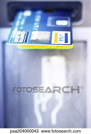 Credit card in ATM slot, close-up View Large Photo Image Stock Image - Credit card in ATM slot, close-up. Fotosearch