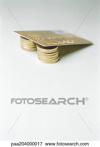 Credit card on coins. View Large Photo Image Stock Photo - Credit card on coins.. Fotosearch