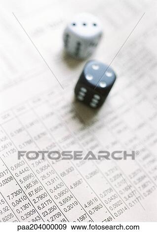 Dice on financial newspaper, close-up View Large Photo Image Stock Photo - Dice on financial newspaper, close-up. Fotosearch