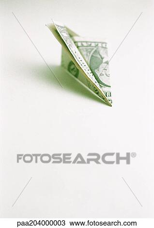 Dollar bill folded into paper airplane View Large Photo Image Stock Image - Dollar bill folded into paper airplane. Fotosearch