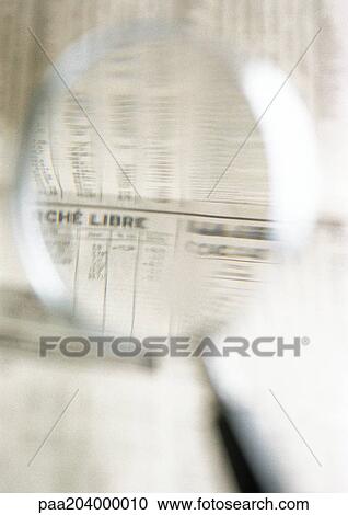 Financial information in newspaper, seen through magnifying glass, close-up View Large Photo Image Stock Image - Financial information in newspaper, seen through magnifying glass, close-up. Fotosearch