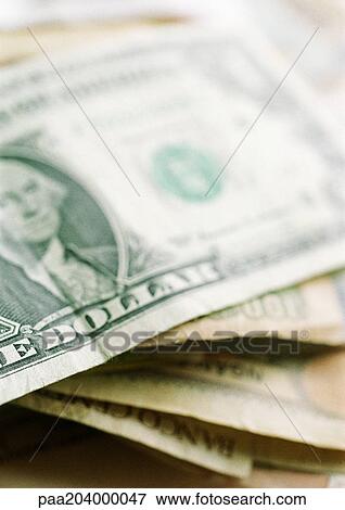 Stock Photo - Stack of paper currency, close-up. Fotosearch