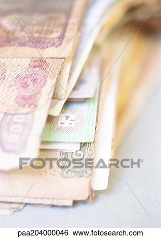 Stack of paper currency, close-up View Large Photo Image Stock Photograph - Stack of paper currency, close-up. Fotosearch