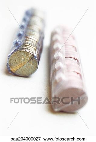 Two rolls of euro coins, close-up View Large Photo Image Stock Photo - Two rolls of euro coins, close-up. Fotosearch