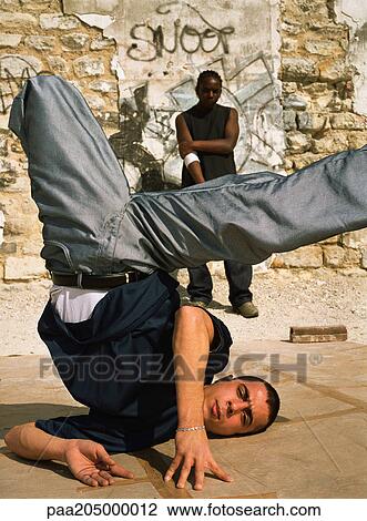 Stock Image - Man break dancing, close-up. Fotosearch