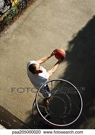 Man preparing to shoot basket, overhead view View Large Photo Image Stock Image - Man preparing to shoot basket, overhead view. Fotosearch