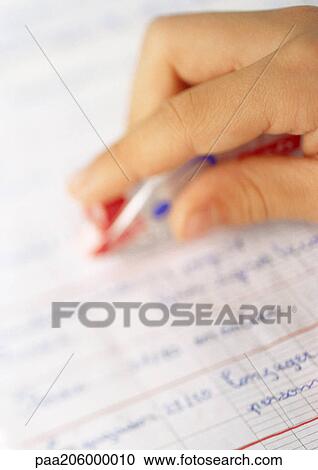 Hand holding correction tape over school notebook. View Large Photo Image Stock Image - Hand holding correction tape over school notebook.. Fotosearch