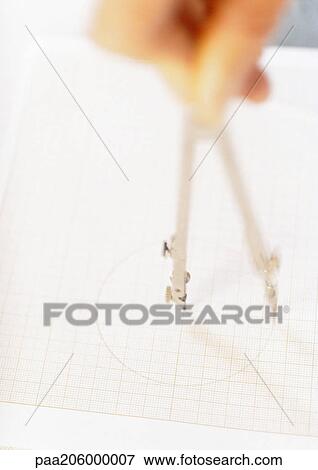 Hand using compass to make circle, close-up View Large Photo Image Stock Photo - Hand using compass to make circle, close-up. Fotosearch