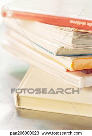 Stock Image - Pile of textbooks, close-up. Fotosearch
