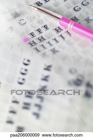 Stock Photo - Rub-off letters and ballpoint pen, close-up. Fotosearch