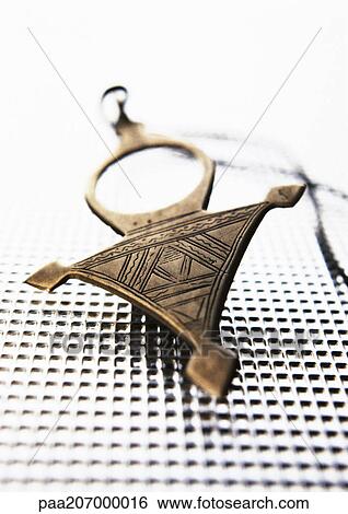 Metal pendant, close-up View Large Photo Image Stock Photograph - Metal pendant, close-up. Fotosearch
