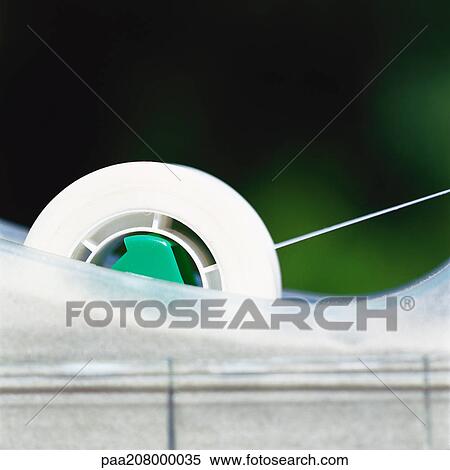 Adhesive tape dispenser, close-up View Large Photo Image Stock Photography - Adhesive tape dispenser, close-up. Fotosearch