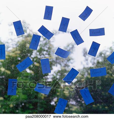 Blue adhesive notes on pane of glass. View Large Photo Image Stock Photo - Blue adhesive notes on pane of glass.. Fotosearch