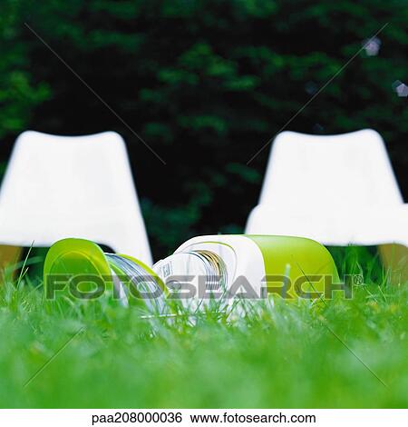 CD case on grass in front of white plastic chairs View Large Photo Image Stock Photograph - CD case on grass in front of white plastic chairs. Fotosearch
