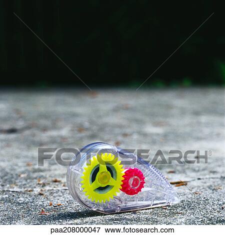 Correction tape dispenser on ground View Large Photo Image Stock Photo - Correction tape dispenser on ground. Fotosearch