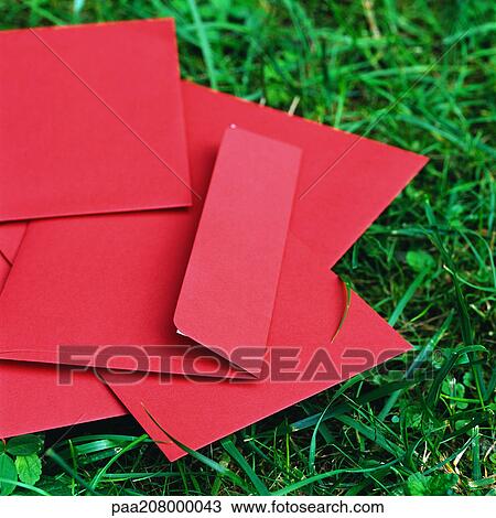 Red envelopes on grass. View Large Photo Image Stock Image - Red envelopes on grass.. Fotosearch