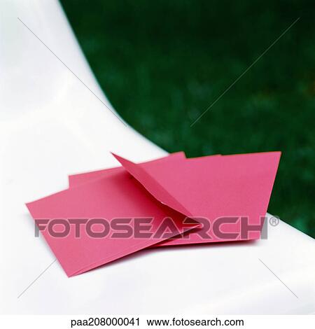 Red envelopes, on white chair. View Large Photo Image Stock Image - Red envelopes, on white chair.. Fotosearch