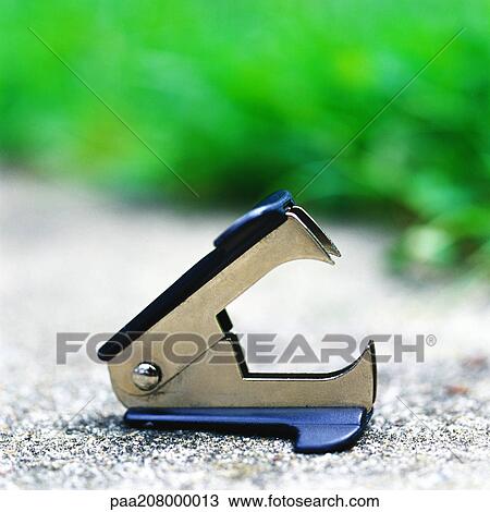 Stock Image - Staple remover on ground. Fotosearch
