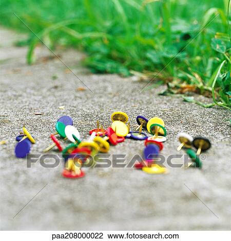 Thumbtacks on ground View Large Photo Image Stock Image - Thumbtacks on ground. Fotosearch