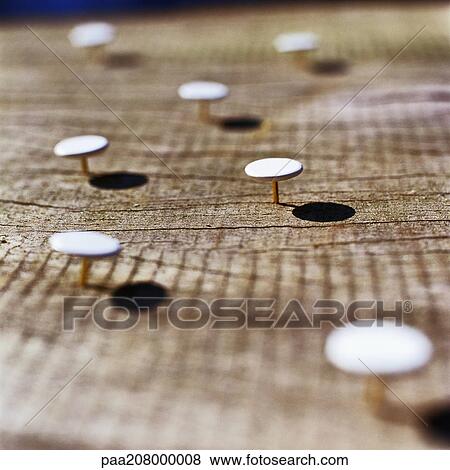 Thumbtacks stuck into wooden surface View Large Photo Image Stock Photo - Thumbtacks stuck into wooden surface. Fotosearch