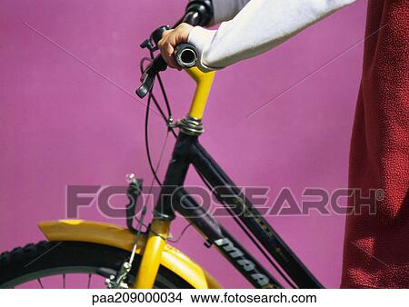 Child and bicycle, close-up. View Large Photo Image Picture - Child and bicycle, close-up.. Fotosearch