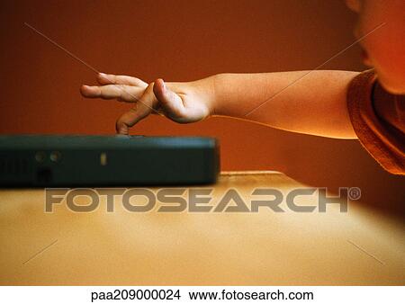 Child, finger on a laptop. View Large Photo Image Picture - Child, finger on a laptop.. Fotosearch