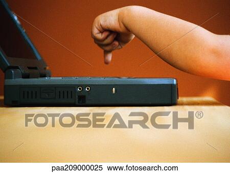 Child, hand pressing the keys of a laptop. View Large Photo Image Stock Photography - Child, hand pressing the keys of a laptop. . Fotosearch
