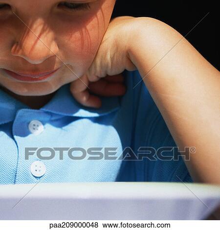 Child looking down, close-up. View Large Photo Image Stock Photo - Child looking down, close-up. . Fotosearch