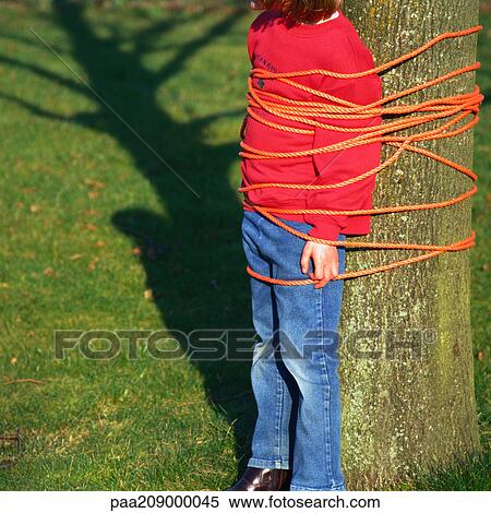 Child tied to tree. View Large Photo Image Stock Photography - Child tied to tree.. Fotosearch