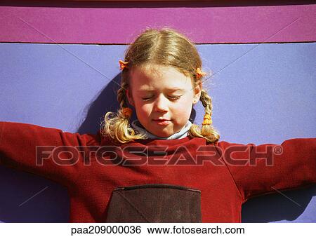 Little girl closing eyes and holding out arms. View Large Photo Image Stock Photograph - Little girl closing eyes and holding out arms.. Fotosearch