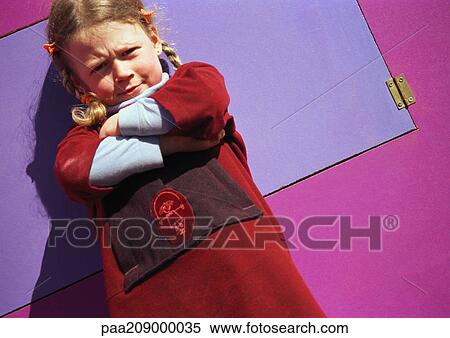 Stock Photography - Little girl frowning and crossing arms.. Fotosearch