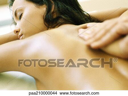 Woman having a massage, rear view. View Large Photo Image Picture - Woman having a massage, rear view.. Fotosearch