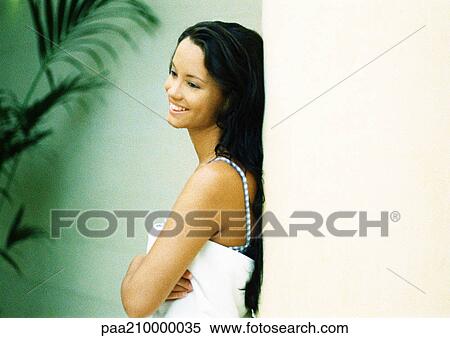 Woman leaning against wall. View Large Photo Image Stock Photography - Woman leaning against wall.. Fotosearch