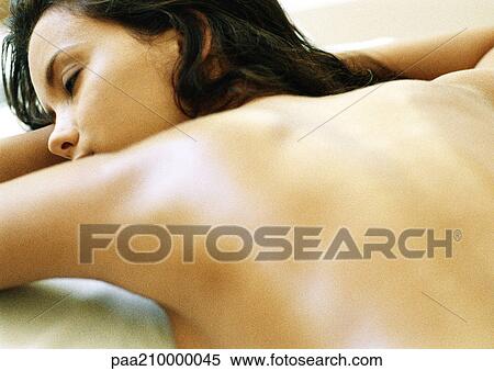 Woman lying on stomach, close-up. View Large Photo Image Stock Photography - Woman lying on stomach, close-up.. Fotosearch