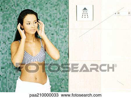 Woman standing next to shower sign. View Large Photo Image Stock Image - Woman standing next to shower sign.. Fotosearch