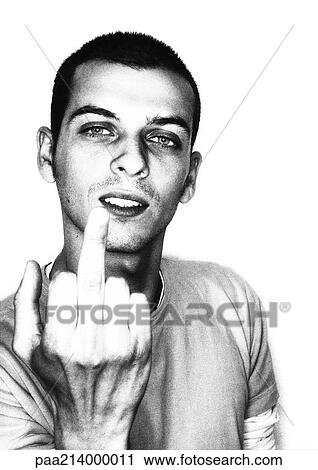 Stock Image - Man giving the finger, portrait, b&w.. Fotosearch