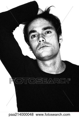 Stock Photo - Man, hand on top of head, portrait, b&w.. Fotosearch